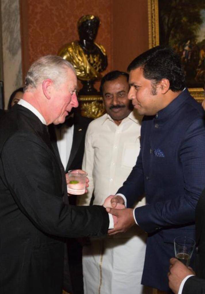 His Royal Highness Prince Charles congratulating Manidhanaeyam trustees on their honourable work.